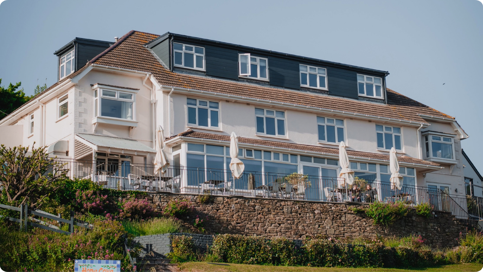 Hope Cove House overlooking its terrace and garden