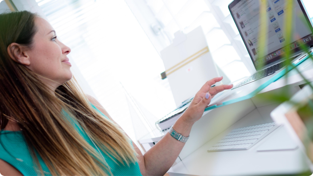 Quay Holiday Lettings host responding to guests from a laptop
